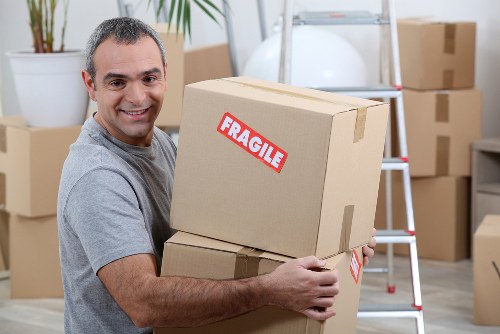 Prepared moving boxes and furniture ready for a man with a van in Surbiton
