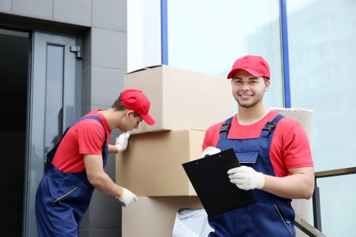 Removal van and moving team in a Surbiton residential street