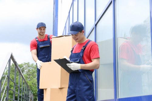Packed moving boxes and wrapped furniture prepared for a house removal
