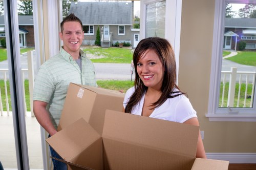 Boxes and household items being organised for transport