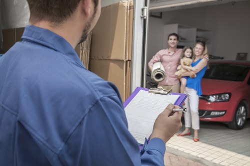 Man with van loading furniture for a local move in Surbiton