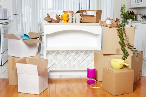 Commercial removals team loading office items for transport