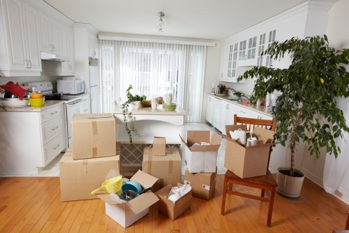 Loading furniture into a moving truck in Surbiton