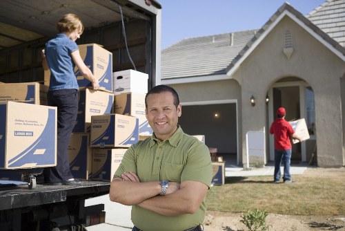 Local home moving service in Surbiton with removal van outside residential houses