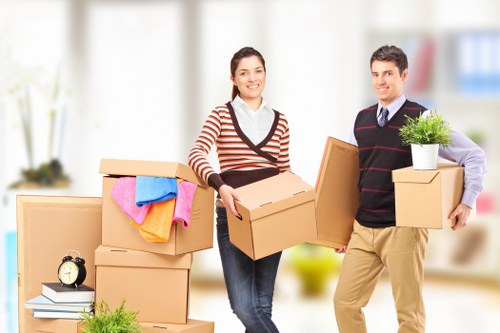 Packed boxes and furniture ready for a local house move in Surbiton