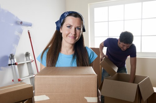 Local office relocation planning with boxes and desks in Surbiton