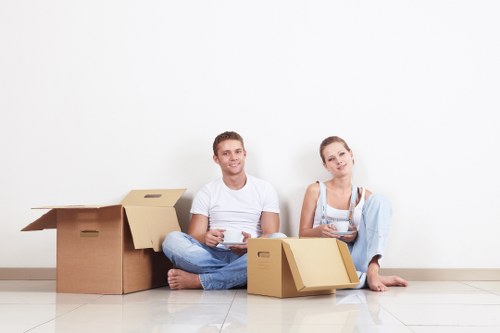 Professional movers handling boxes and furniture for a local relocation