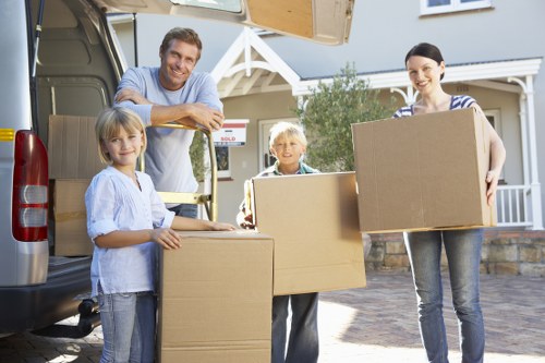 Professional movers loading items for a flat or home relocation