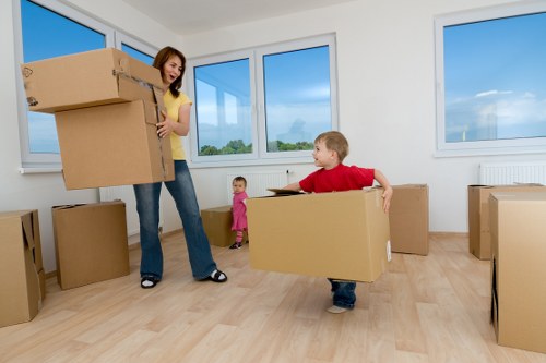 Moving team loading furniture into a van for a local relocation