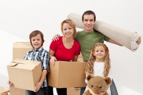Local movers organising boxes in a Surbiton property