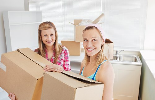 Packed moving boxes and furniture for a house removal
